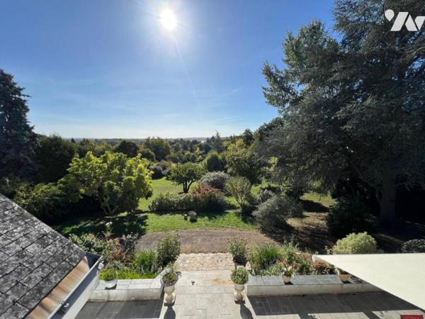 Au THOUREIL Maison avec vie de plain-pied dans parc paysager 
