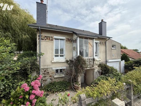 Maison en centre bourg avec beau jardin et logement annexe