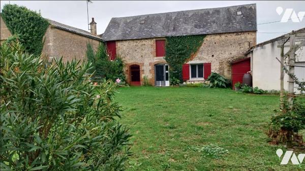 Un ensemble immobilier, composé de deux logements, à usage de gîte rural.