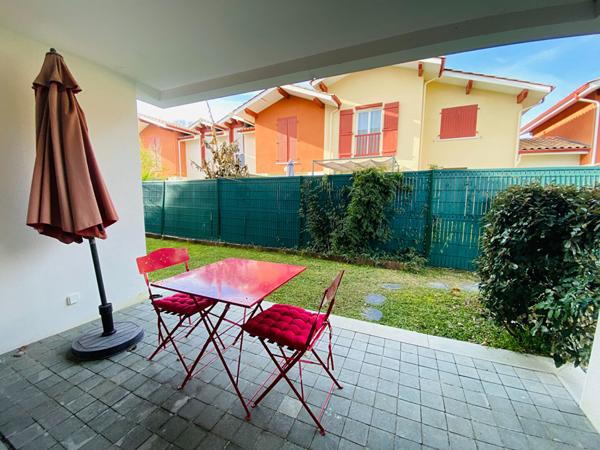 Appartement T3  avec jardinet, cellier et parkings