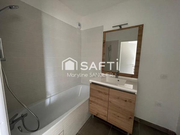 T2 neuf livré au coeur du village avec balcon