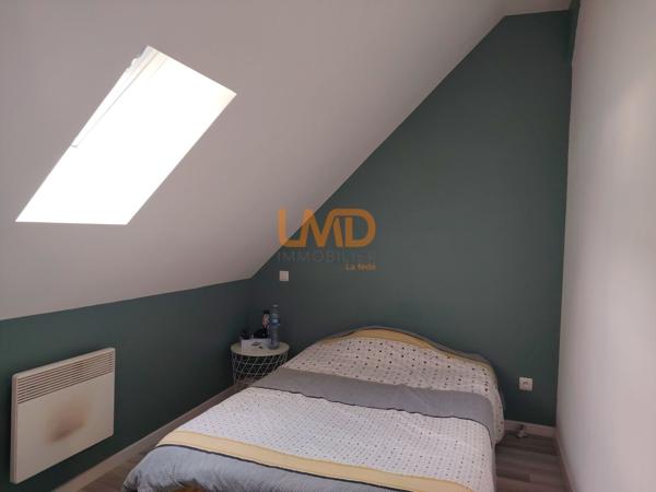 Immeuble de rapport rénové : 3 appartements + caves + garages + jardin