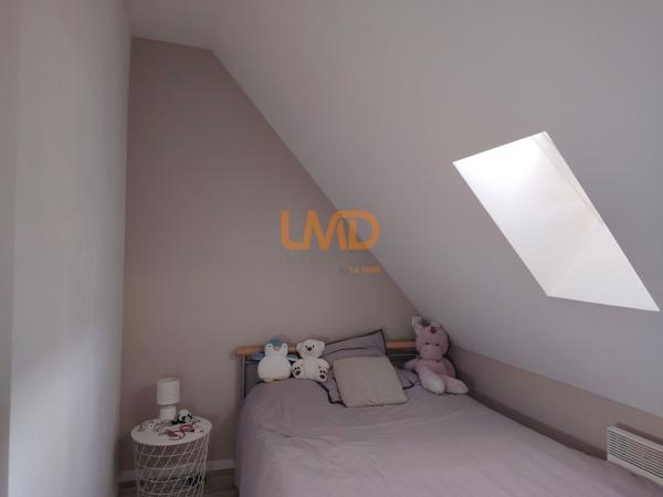 Immeuble de rapport rénové : 3 appartements + caves + garages + jardin