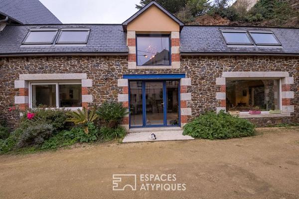 Maison en pierre avec un gîte