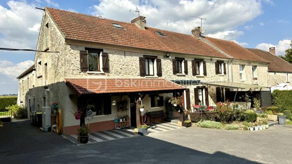 Découvrez cette magnifique propriété rénovée, de type "corps de ferme", située sur le  village calme de REBAIS à seulement 15 minutes de Coulommiers et de sa gare pour un accès rapide à Paris en 40 minutes. Parfaitement intégrée dans un environnement paisible, cette maison offre un cadre de vie exceptionnel.

Caractéristiques principales : Surface utile de 390 m² et habitable de 335 m². Terrain de 2600 m² sans vis-à-vis. Dépendances et garages  de 250 m² avec étages aménageables. Terrasses : 100 m² offrant de superbes vues dégagées. Double accès & Division foncière possible
- Rez-de-chaussée : Vaste entrée avec un salon-séjour lumineux de plus de 60 m², une cuisine séparée et entièrement équipée, une salle à manger de 17 m², un espace bureau de 9 m², salle d'eau avec WC, une autre salle de bains ainsi qu’une pièce de 25 m² aménageable en studio indépendant. L'arrière-cuisine et buanderie complètent ce niveau.

- Étage : Trois chambres (9 à 14 m²) et une suite parentale spacieuse de 41 m² comprenant une chambre climatisée, une salle de bain avec baignoire et douche, un WC, un dressing, et un espace bureau. L'étage abrite également un espace spa avec piscine à contre-courant, salle d'eau, WC, et une mezzanine dédiée aux loisirs. Le tout donnant sur une terrasse surélevée avec vue panoramique sur la vallée.

- Deuxième étage : Une salle de sport de 41 m² au sol, ainsi qu’un espace aménageable de 55 m².

- Extérieur : Profitez de l’immense terrain de 2600 m² sans vis-à-vis, agrémenté de terrasses et joliment arboré. Plusieurs dépendances et garages vous offrent de vastes espaces de rangement ou la possibilité d’aménager des studios ou ateliers.

> Équipements modernes : Chauffage au gaz de ville et pompe à chaleur pour un confort optimal (excellente performance énergétique). Portail et portes de garage motorisés, volets roulants électriques.
> Localisation idéale : Écoles et commerces à proximité, cette propriété est parfaite pour une vie familiale paisible à seulement 15 minutes de la gare reliant Paris.

Ne manquez pas cette opportunité unique d’acquérir une maison de caractère, alliant charme de l’ancien et confort moderne. 
Contactez-nous pour plus d'informations et organiser une visite.
