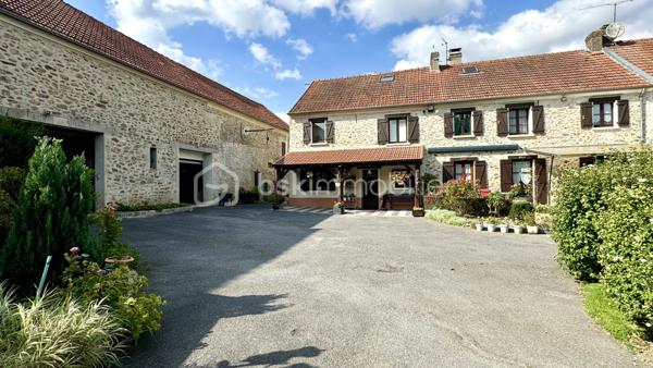 Découvrez cette magnifique propriété rénovée, de type "corps de ferme", située sur le  village calme de REBAIS à seulement 15 minutes de Coulommiers et de sa gare pour un accès rapide à Paris en 40 minutes. Parfaitement intégrée dans un environnement paisible, cette maison offre un cadre de vie exceptionnel.

Caractéristiques principales : Surface utile de 390 m² et habitable de 335 m². Terrain de 2600 m² sans vis-à-vis. Dépendances et garages  de 250 m² avec étages aménageables. Terrasses : 100 m² offrant de superbes vues dégagées. Double accès & Division foncière possible
- Rez-de-chaussée : Vaste entrée avec un salon-séjour lumineux de plus de 60 m², une cuisine séparée et entièrement équipée, une salle à manger de 17 m², un espace bureau de 9 m², salle d'eau avec WC, une autre salle de bains ainsi qu’une pièce de 25 m² aménageable en studio indépendant. L'arrière-cuisine et buanderie complètent ce niveau.

- Étage : Trois chambres (9 à 14 m²) et une suite parentale spacieuse de 41 m² comprenant une chambre climatisée, une salle de bain avec baignoire et douche, un WC, un dressing, et un espace bureau. L'étage abrite également un espace spa avec piscine à contre-courant, salle d'eau, WC, et une mezzanine dédiée aux loisirs. Le tout donnant sur une terrasse surélevée avec vue panoramique sur la vallée.

- Deuxième étage : Une salle de sport de 41 m² au sol, ainsi qu’un espace aménageable de 55 m².

- Extérieur : Profitez de l’immense terrain de 2600 m² sans vis-à-vis, agrémenté de terrasses et joliment arboré. Plusieurs dépendances et garages vous offrent de vastes espaces de rangement ou la possibilité d’aménager des studios ou ateliers.

> Équipements modernes : Chauffage au gaz de ville et pompe à chaleur pour un confort optimal (excellente performance énergétique). Portail et portes de garage motorisés, volets roulants électriques.
> Localisation idéale : Écoles et commerces à proximité, cette propriété est parfaite pour une vie familiale paisible à seulement 15 minutes de la gare reliant Paris.

Ne manquez pas cette opportunité unique d’acquérir une maison de caractère, alliant charme de l’ancien et confort moderne. 
Contactez-nous pour plus d'informations et organiser une visite.