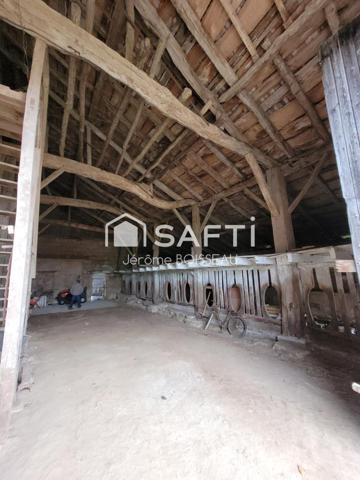 sur un terrain de 3000 m2 maison et grange