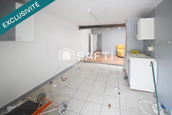 Immeuble avec 5 appartements et 1 garage!