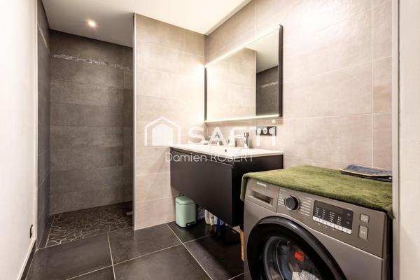 GRANDE APPARTEMENT AU CENTRE DU VILLAGE