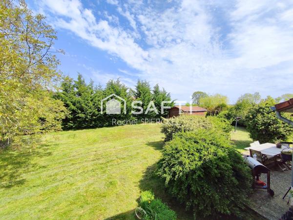 Maison individuelle sur demi niveau avec garage et grand jardin