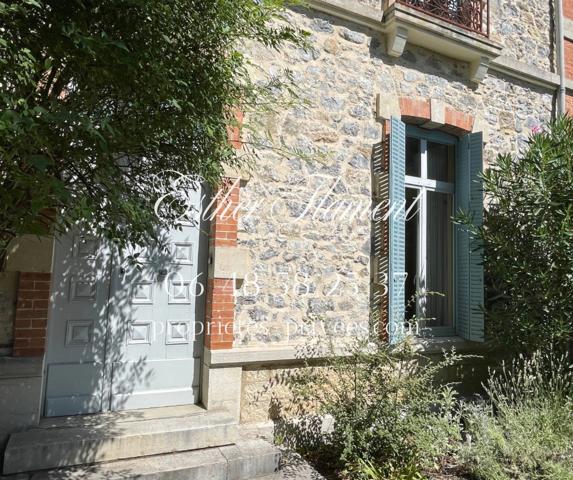 Maison bourgeoise en pierre avec jardin
