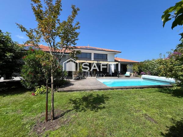 Maison contemporaine - 4 chambres - 3 salle d'eau - garage/atelier - piscine
