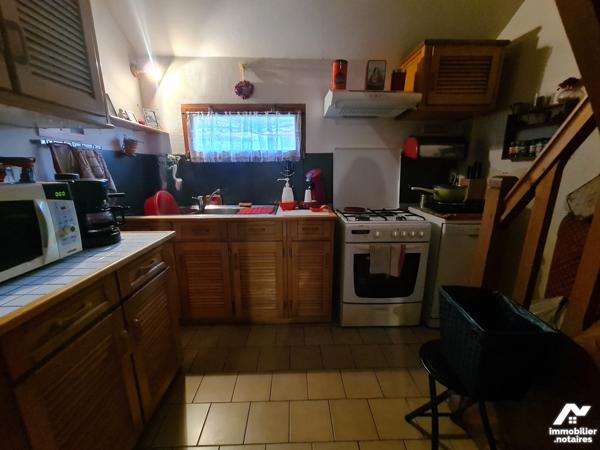 YVETOT,  maison divisée en 2 logements loués, 2 garages, terrain