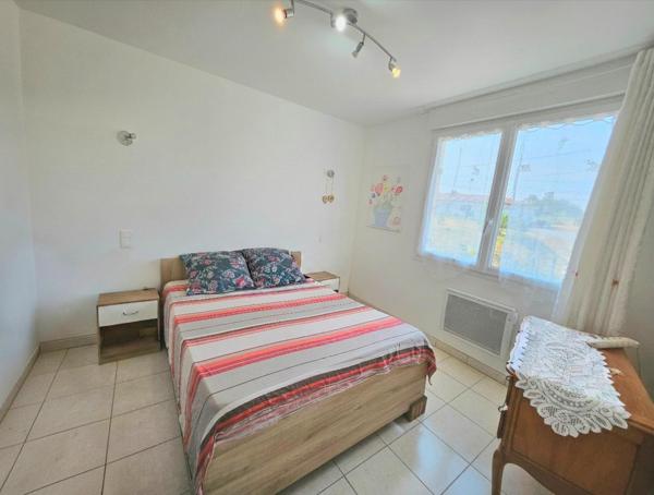 MAISON DIVISÉE EN DEUX APPARTEMENTS AVEC JARDIN