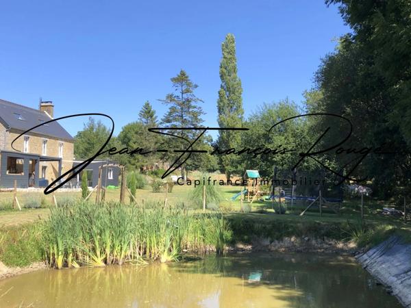 A trois kilomètres du centre de Tessy sur Vire, charmante maison en pierres rénovée d'une surface de 175 m² !!!