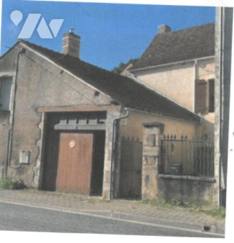 Maison d'habitation comprenant 3 chambres, 2 garages et 1 courette.