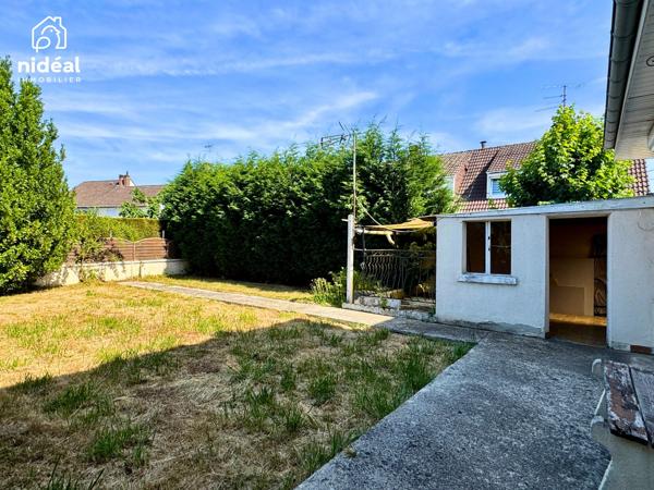 Masion semi-individuelle avec garage et jardin à améliorer