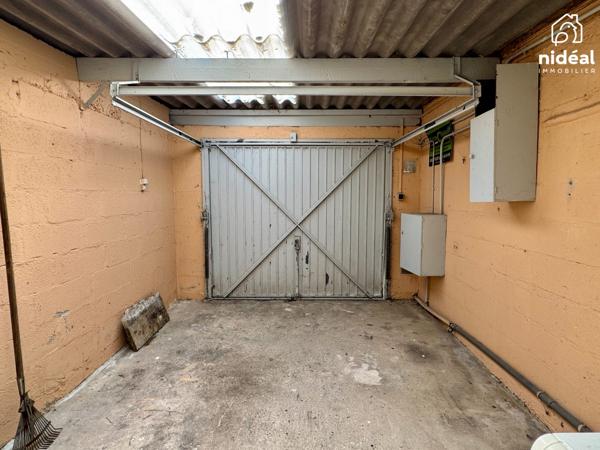 Masion semi-individuelle avec garage et jardin à améliorer