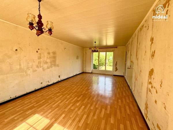 Masion semi-individuelle avec garage et jardin à améliorer