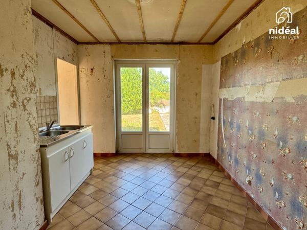 Masion semi-individuelle avec garage et jardin à améliorer