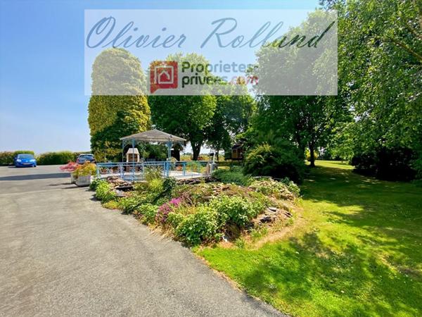 Magnifique longère rénovée avec goût au coeur d'un superbe parc