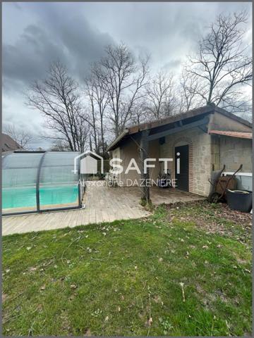 Maison avec 3 chambres et un bureau, un car port 2 places et une dépendance avec piscine