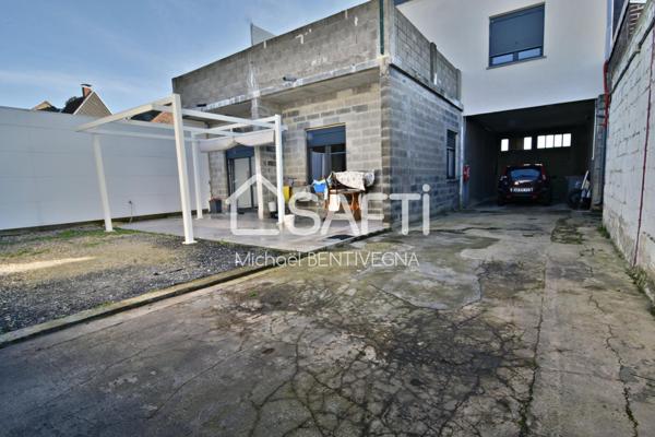 Immeuble de rapport et hangar avec terrain.