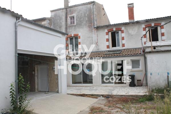 Opportunité unique à Cozes : Maison avec jardin et local commercial !