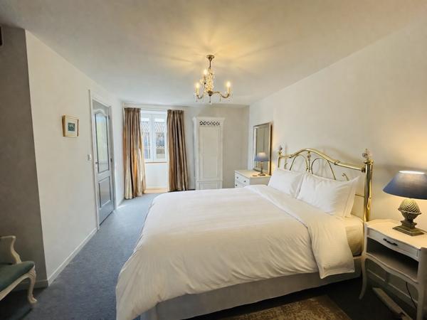 Immaculately Renovated 4-Bedroom, 3-Bathroom Village Home with Courtyard, Garage and Barn