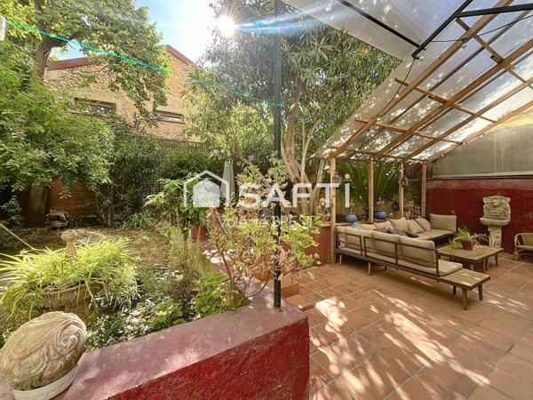 Bail  a céder -Local plus appartement -jardin de 200m2.