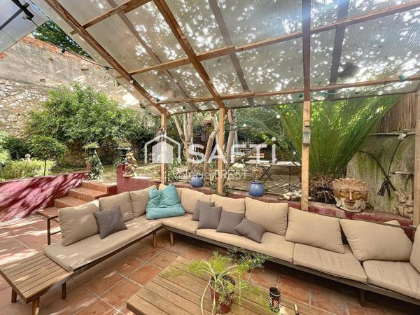 Bail  a céder -Local plus appartement -jardin de 200m2.