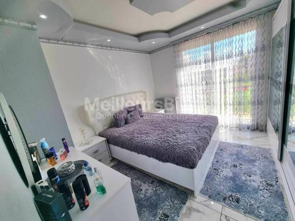 Pavillon accolée sur sous sol avec terrain