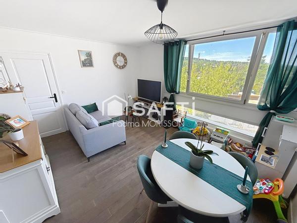 Appartement 65m² balcon, cave, et place de parking boxée