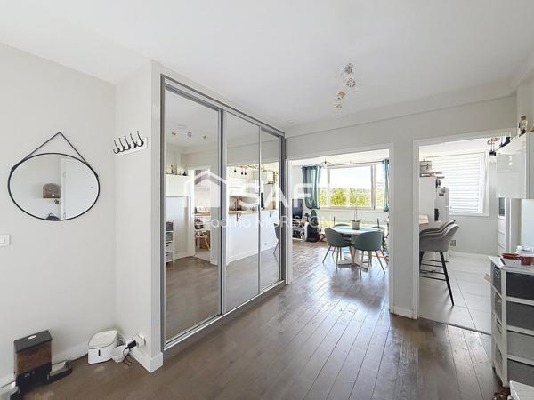 Appartement 65m² balcon, cave, et place de parking boxée