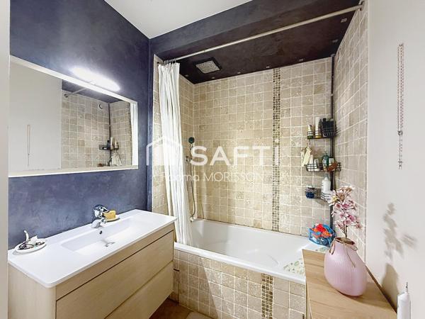 Appartement 65m² balcon, cave, et place de parking boxée