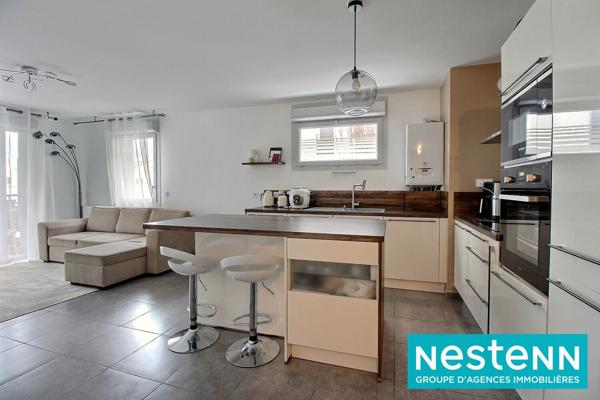 Appartement Meyzieu 4 pièce(s) 77 m2 avec balcon, cave et place de parking sécurisée