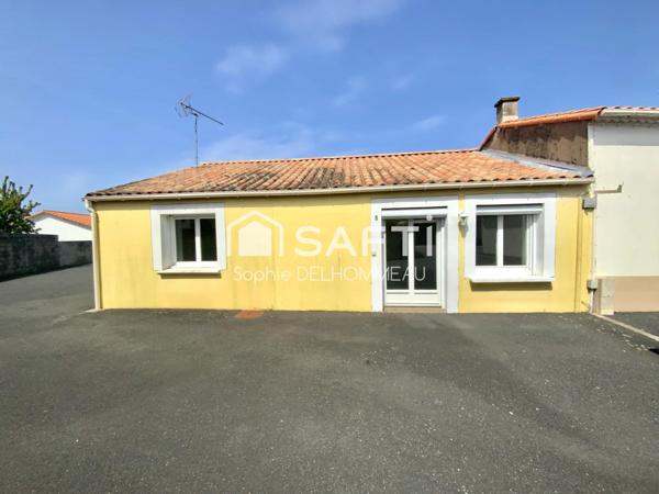 Maison de plain-pied avec 2 chambres et cour extérieure