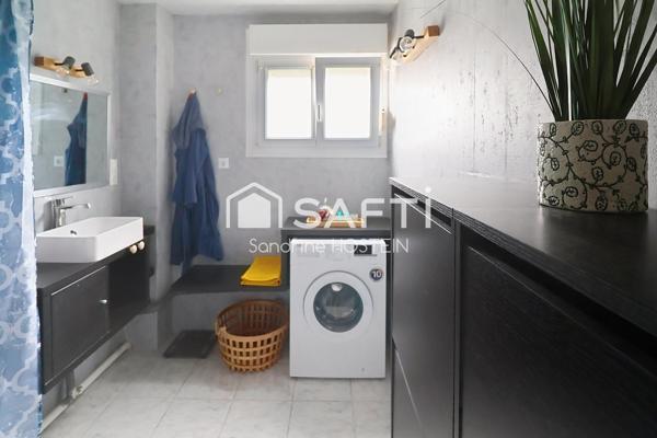 Appartement de 60m2 1 chambre avec balcon et cave privée.