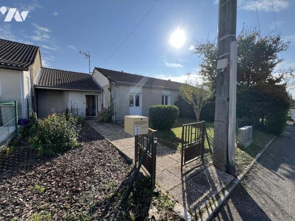 Maison d'habitation  mitoyenne avec un garage 
