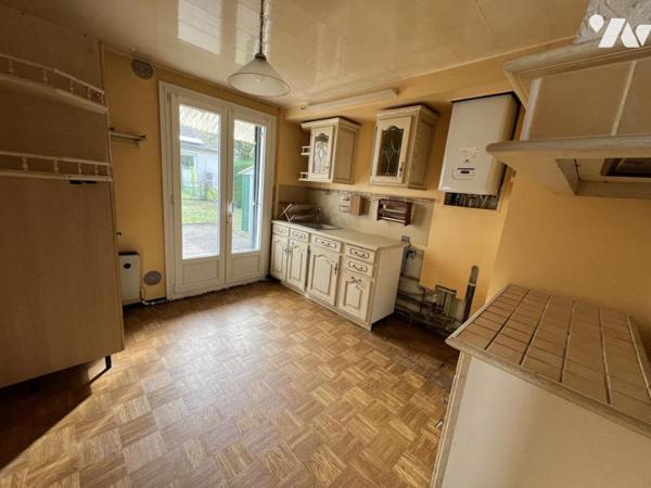 Maison d'habitation  mitoyenne avec un garage 