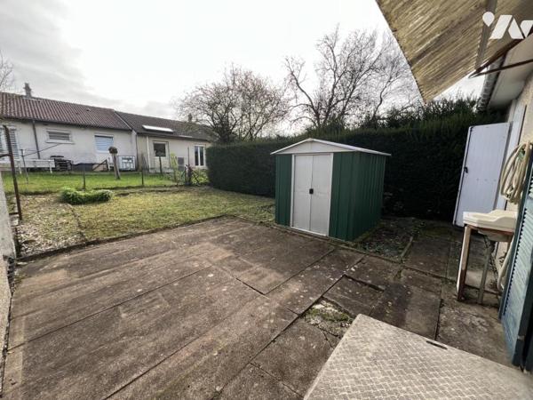 Maison d'habitation  mitoyenne avec un garage 