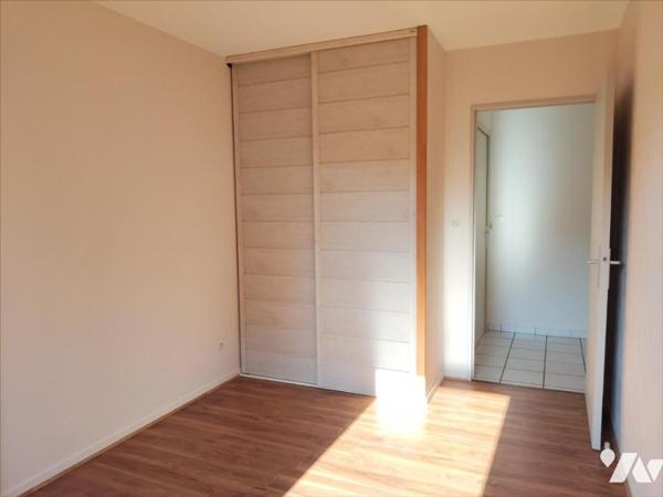 Appartement en parfait état 2ch avec balcon, garage et vue dégagée