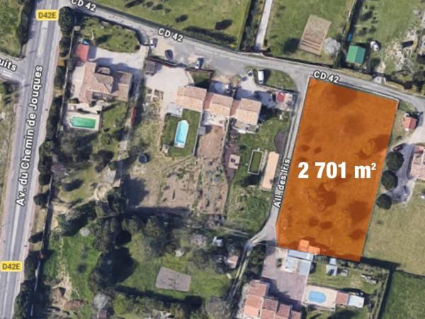 Terrain clôturé de 2 701 m2 en zone Nh