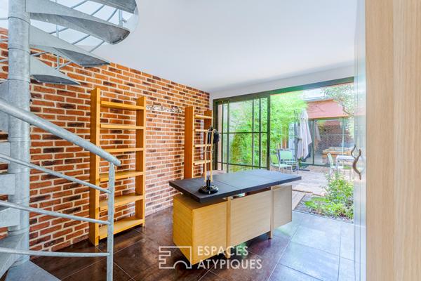 Anciens entrepôts de presse réhabilités en loft de plain pied avec patios