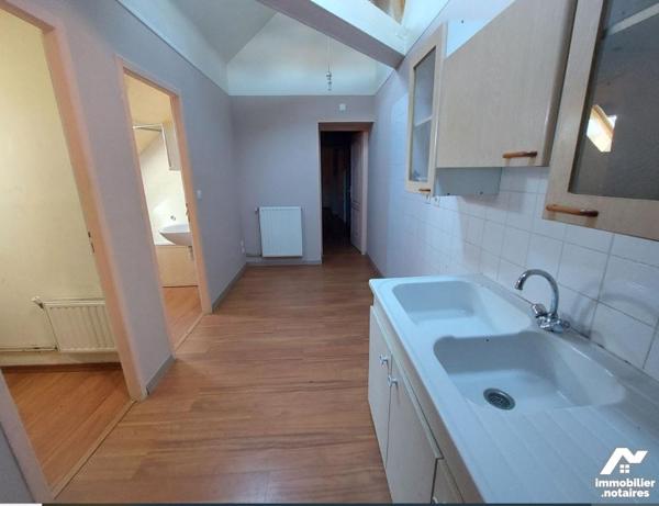 Immeuble à vendre à ATTIGNY (08130) comprenant 4 appartements, 1 local professionnel et deux garages