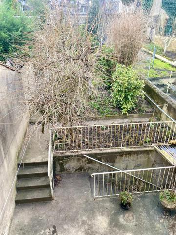 Maison de ville avec garage et jardin