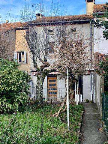 Maison de ville avec garage et jardin