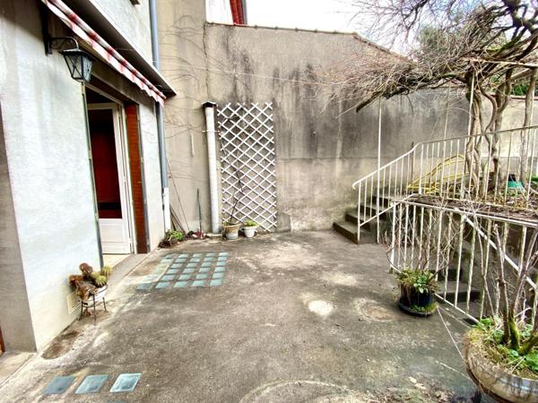 Maison de ville avec garage et jardin