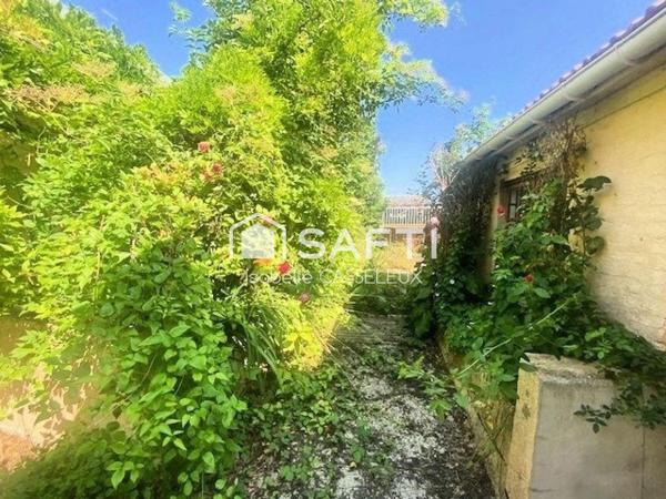 Maison de ville - pièces spacieuses - 2 chambres - jardin - garage