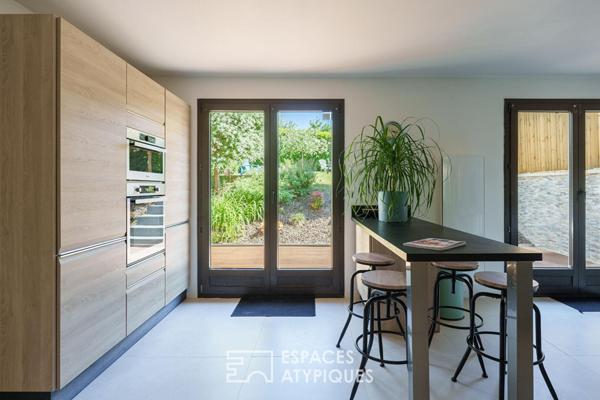 Maison rénovée et son jardin paysager